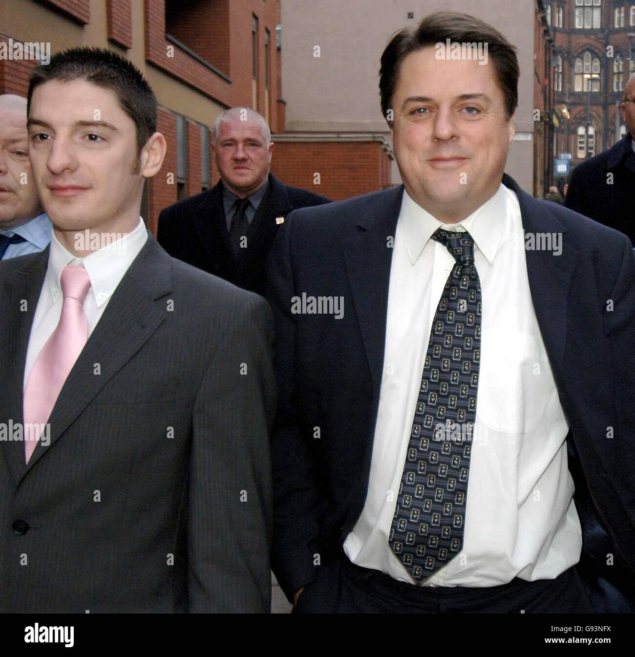 British National Party leader Nick Griffin (right) and party activist Mark Collett (left) arrive at Leeds Crown Court where their trial continues Tuesday January 24, 2006. Griffin has pleaded not guilty to four race hate charges in connection with a BBC undercover documentary on the party, while Collett has denied eight similar charges. Watch for PA story COURTS BNP. PRESS ASSOCIATION photo. Photo credit should read: John Giles/PA. Stock Photo