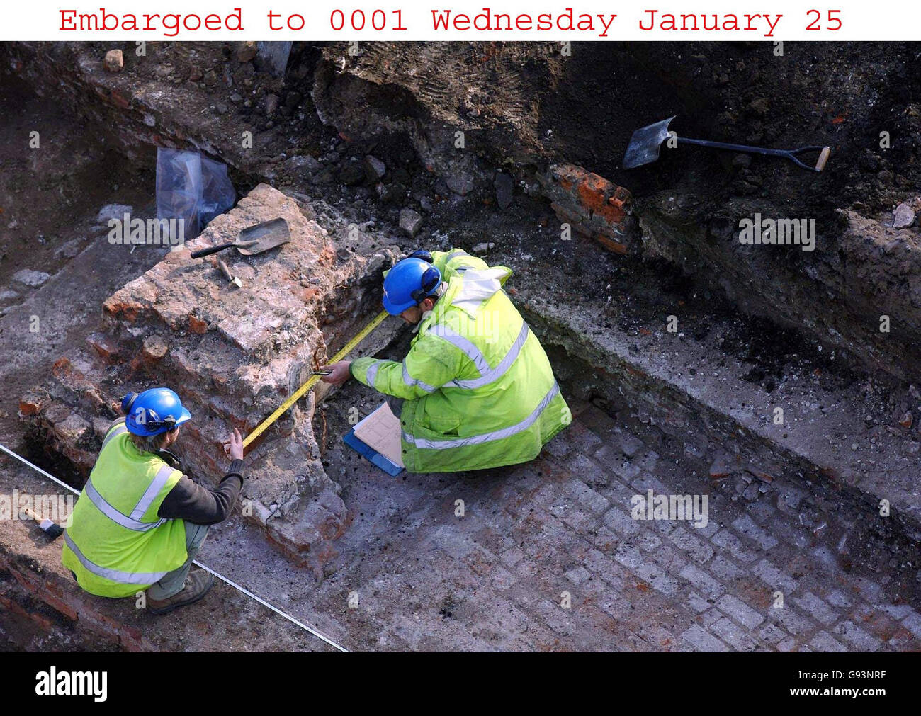 Two archaeologists continue work on the uncovering of the original tiled floor of Henry VIII's royal chapel, which was unexpectedly revealed during work on the drains at the Old Royal Naval College in Greenwich, south London. PRESS ASSOCIATION photo. Photo credit should read: Matthew Fearn/PA. Stock Photo