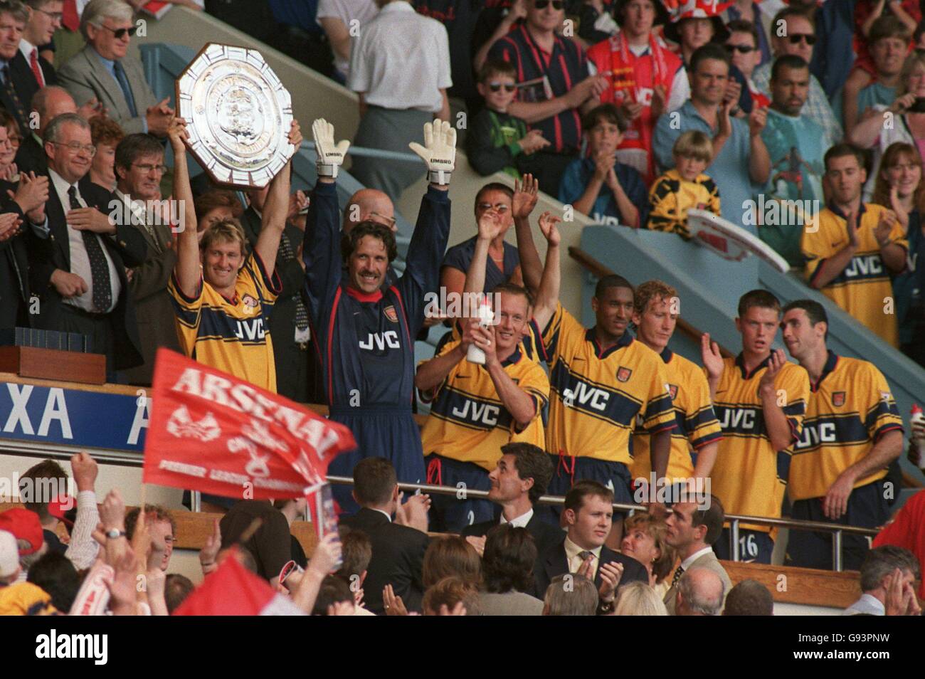 Arsenal captain Tony Adams holds up the AXA FA Charity Shield Stock