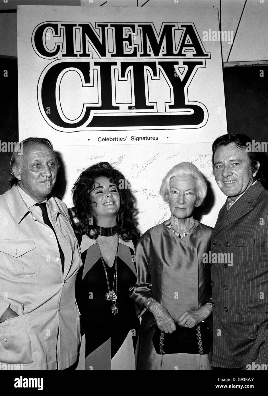 Elizabeth Taylor and Richard Burton (on left), with film critic Dilys powell and director Joeseph Losey. Stock Photo