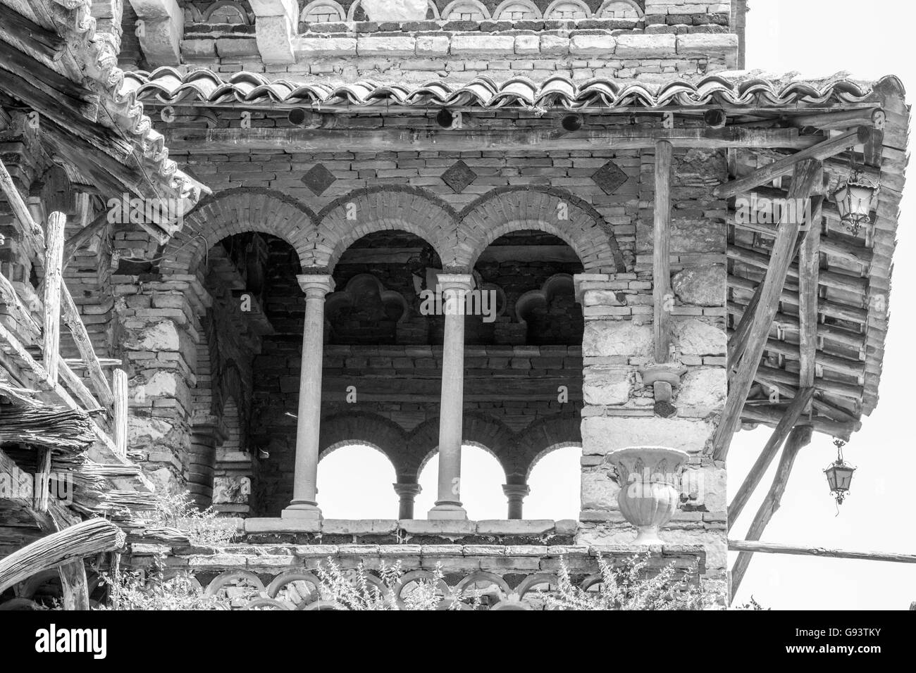 Close up of window in buildings designed by Lady Florence Trevelyan in Public Gardens, Taormina in black and white Stock Photo