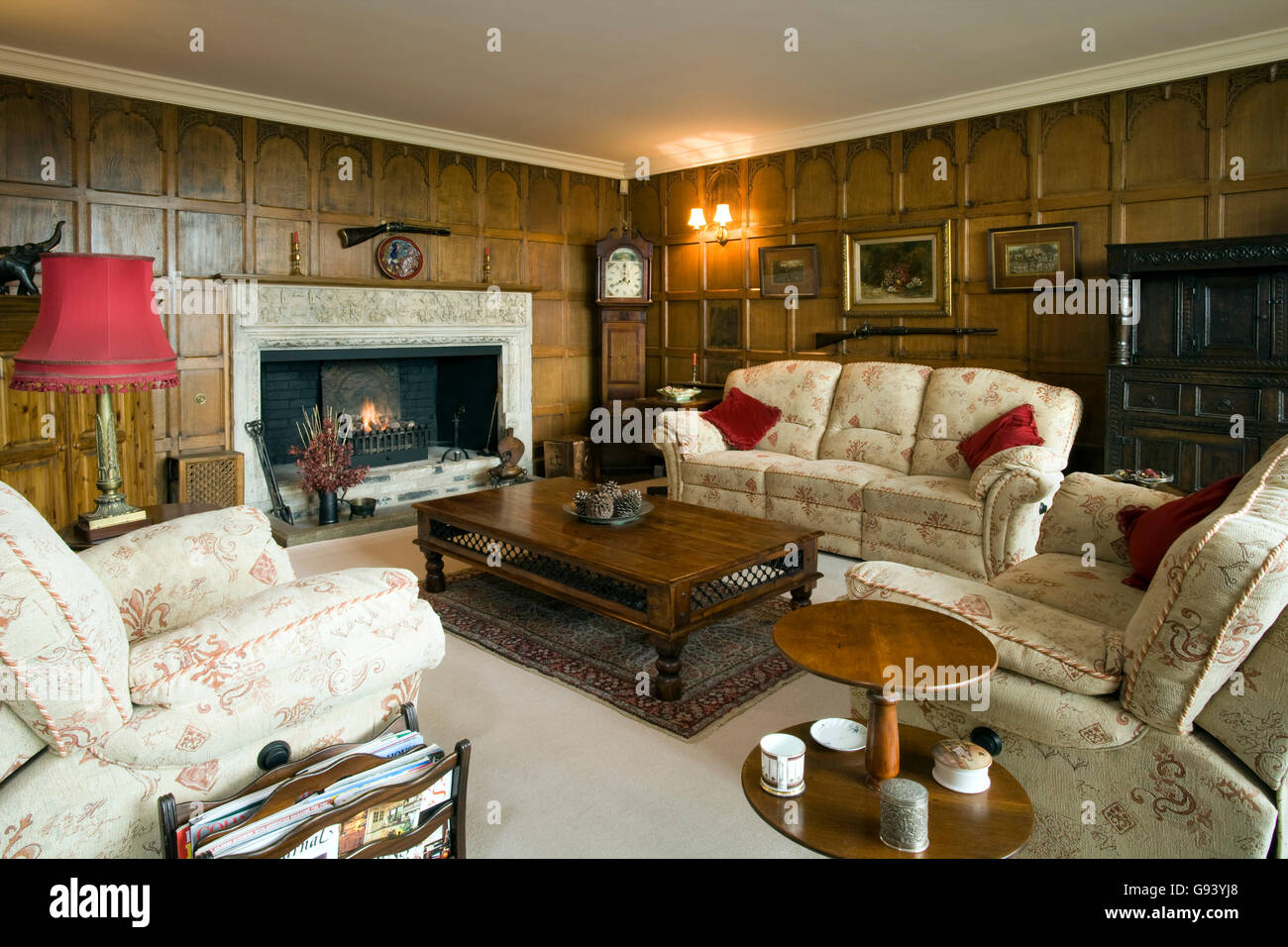 UK. A traditional wood paneled British drawing room interior. Stock Photo