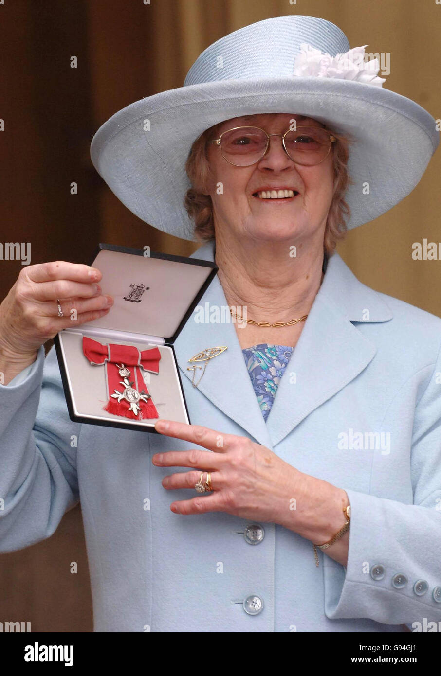 Eileen Kear holds her MBE, which she received from Britain's Queen Elizabeth II at Buckingham Palace, Wednesday February 22, 2006. See PA Story ROYAL Investiture. PRESS ASSOCAITION Photo. Photo credit should read: Stefan Rousseau/WPA Rota/PA. Stock Photo