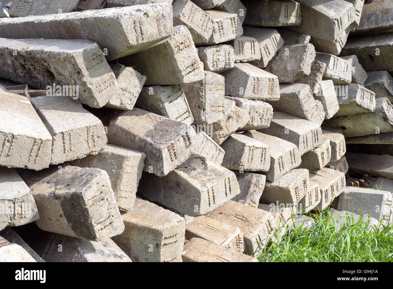 Piles of concrete reinforcement pillars used for foundations in the construction and building industry Stock Photo