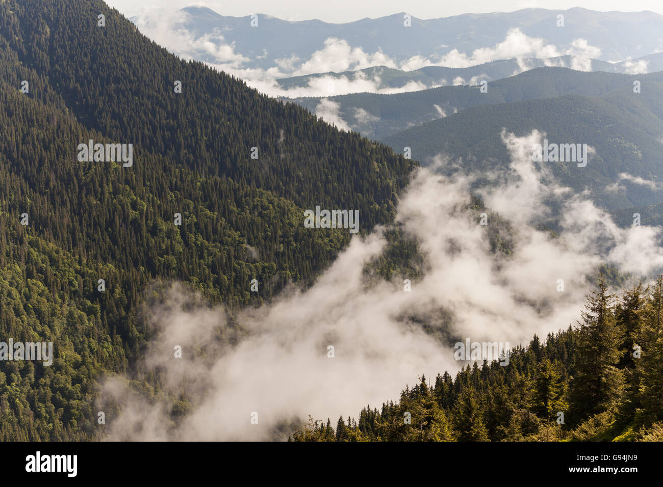 Clouds fog covering hills hi-res stock photography and images - Alamy