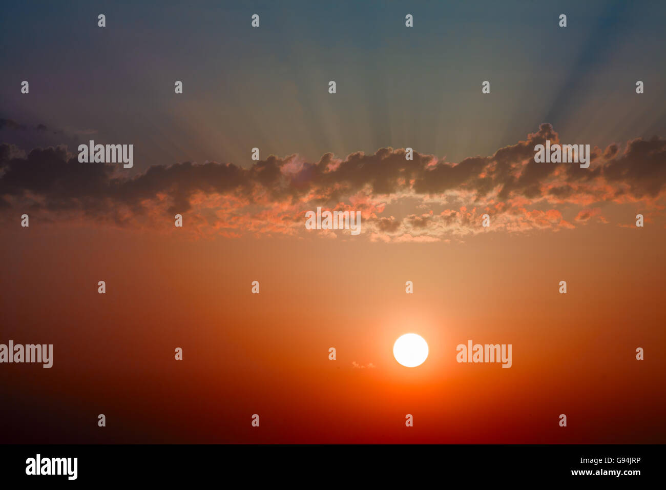 Sunset / sunrise with clouds, light rays and other atmospheric effect ...