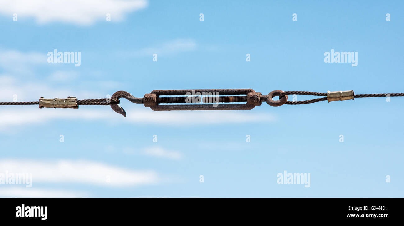 Metallic rope with hook. Industrial scene. Fasteners theme. Taut rope