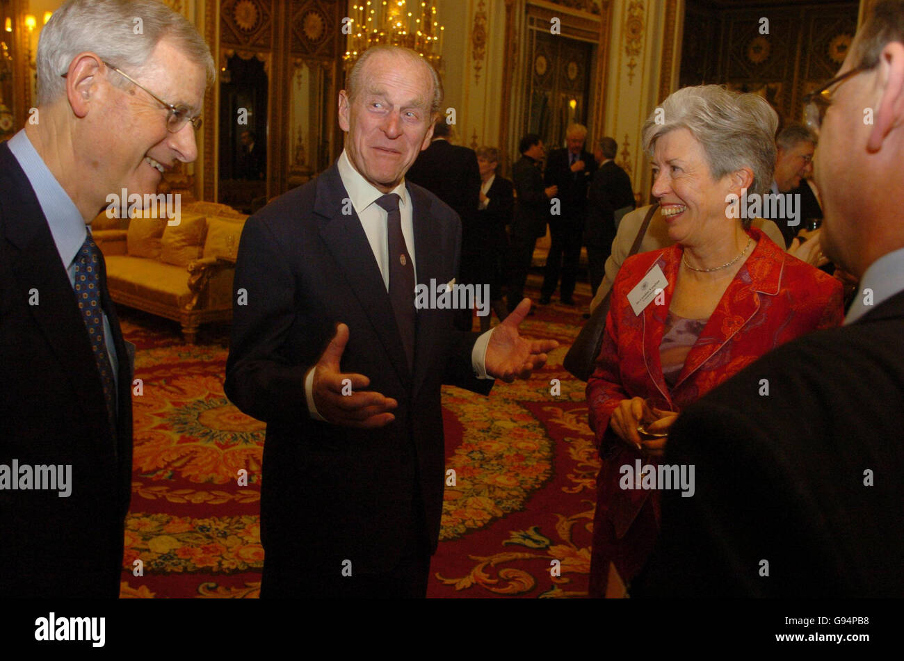 The Duke of Edinburgh jokes with Dr Caroline Vaughan and Sir Alan Rudge (left) inside the White Drawing Room at Buckingham Palace in central London, Monday February 20, 2006. The Duke of Edinburgh was being honoured with the Royal Commission's inaugural medal for the significant contribution made by HRH as President of the Commission over the past 41 years, the first such medal to have awarded by the Royal Commission since 1851. PRESS ASSOCIATION PHOTO. Photo credit should read: Johnny Green/WPA/PA. Stock Photo