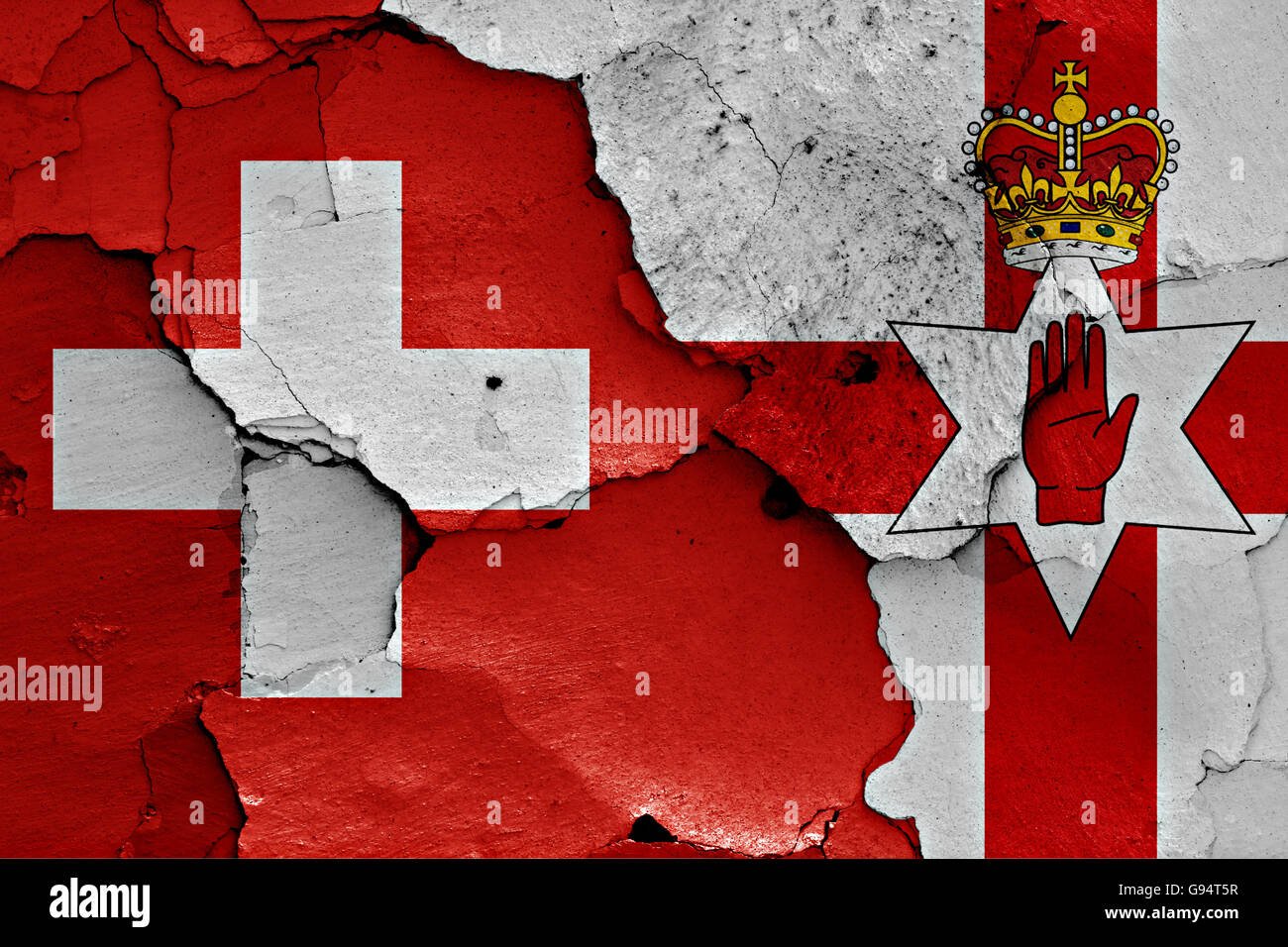 flags of Switzerland and Northern Ireland painted on cracked wall Stock Photo