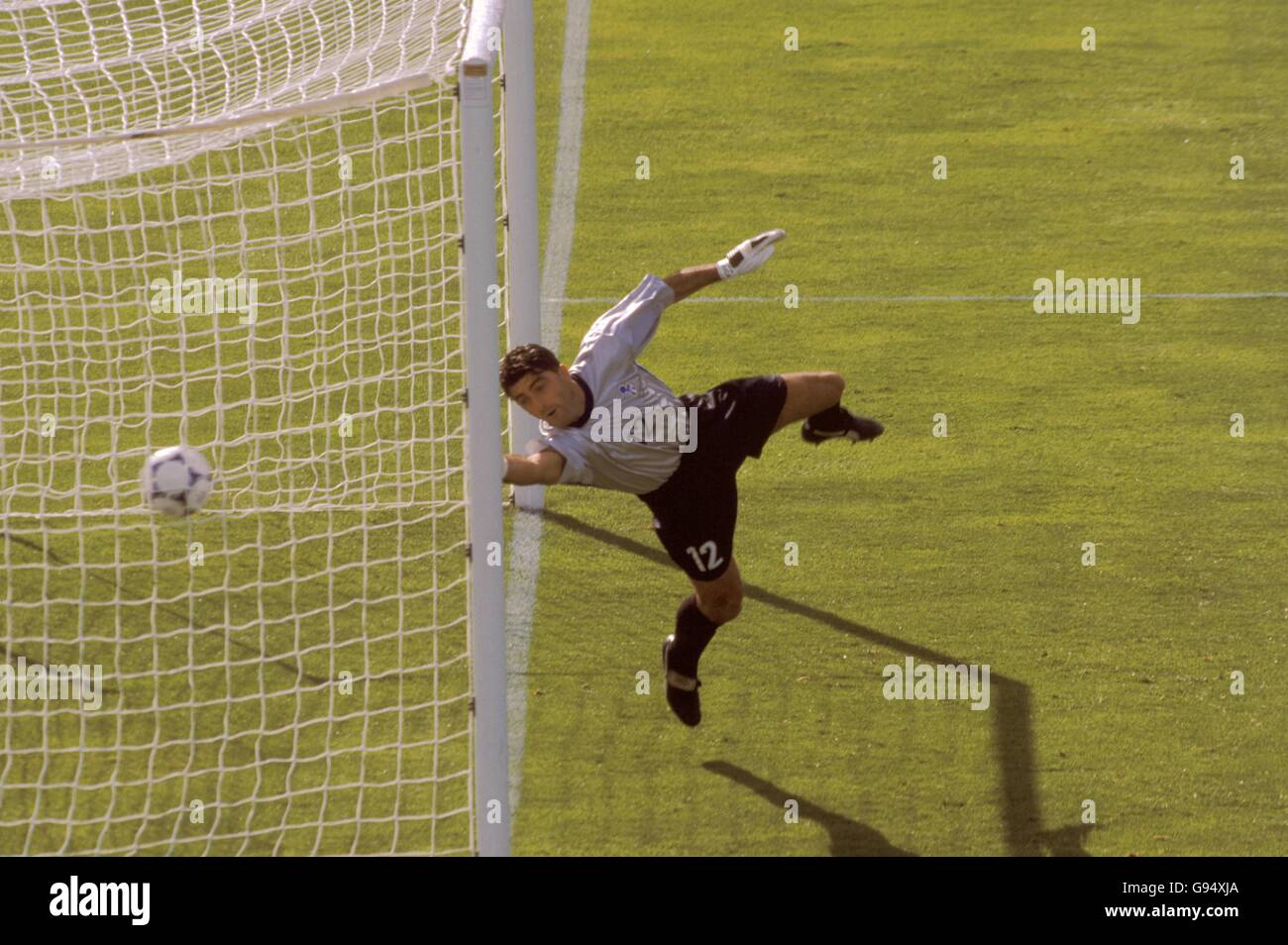 Italy's Gianluca Pagliuca fails to save a header from Chile's Marcelo Salas. Stock Photo