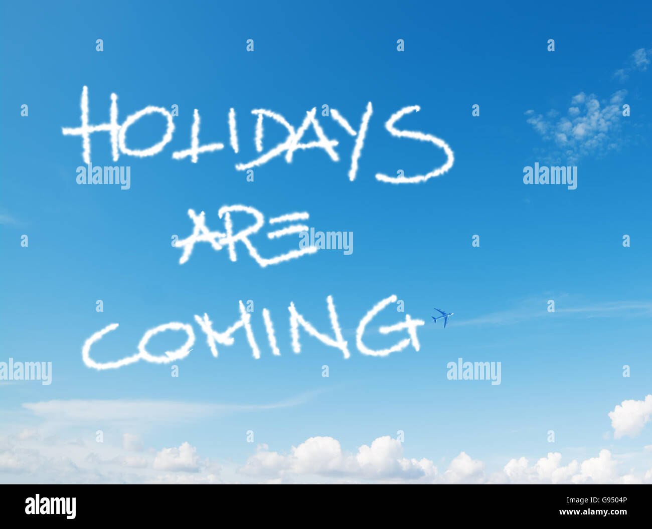 "holidays are coming" written in the sky with contrails left by
