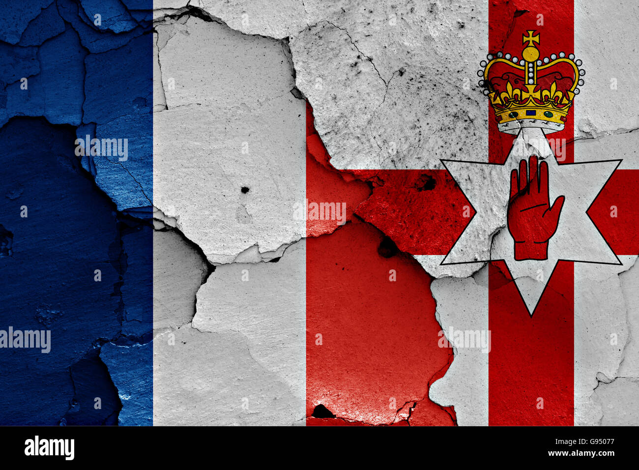 flags of France and Northern Ireland painted on cracked wall Stock Photo