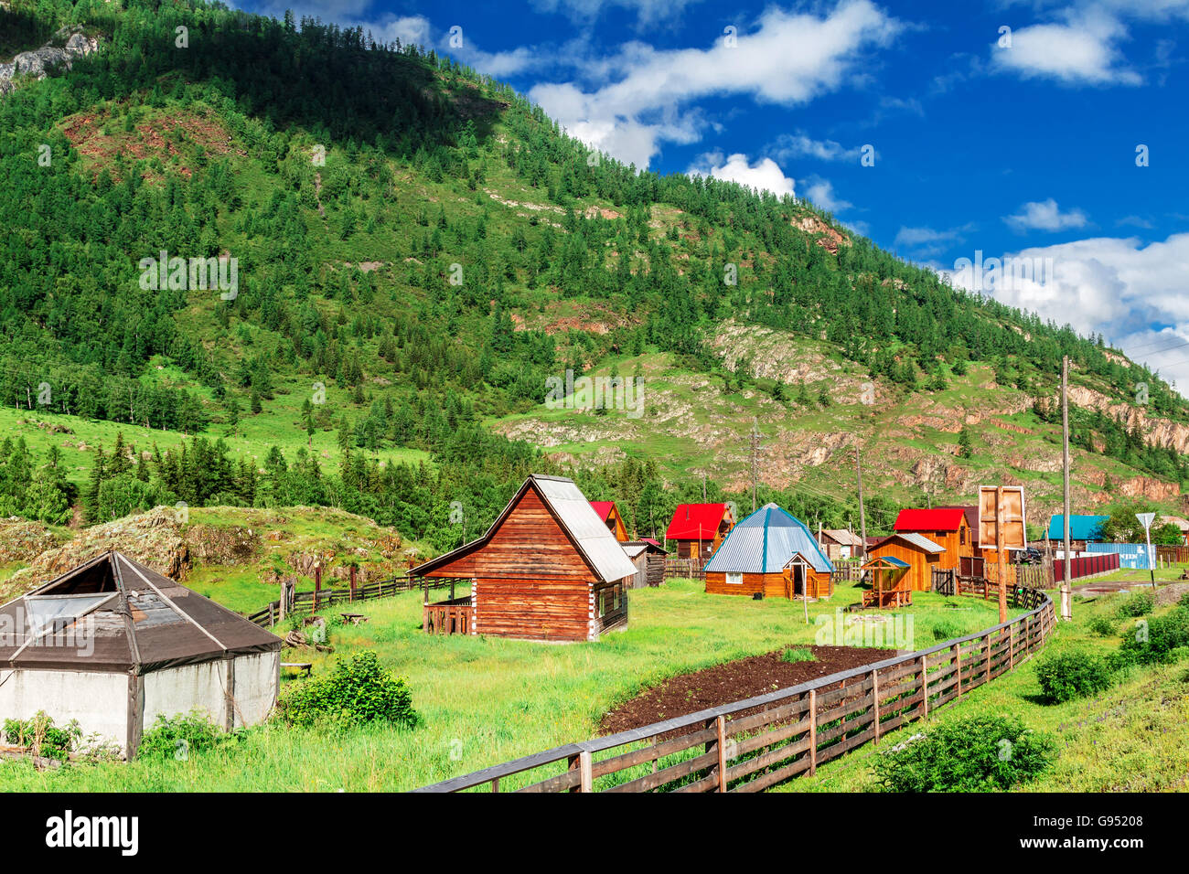 A small village in a mountain valley at the foot of the Altai Mountains ...