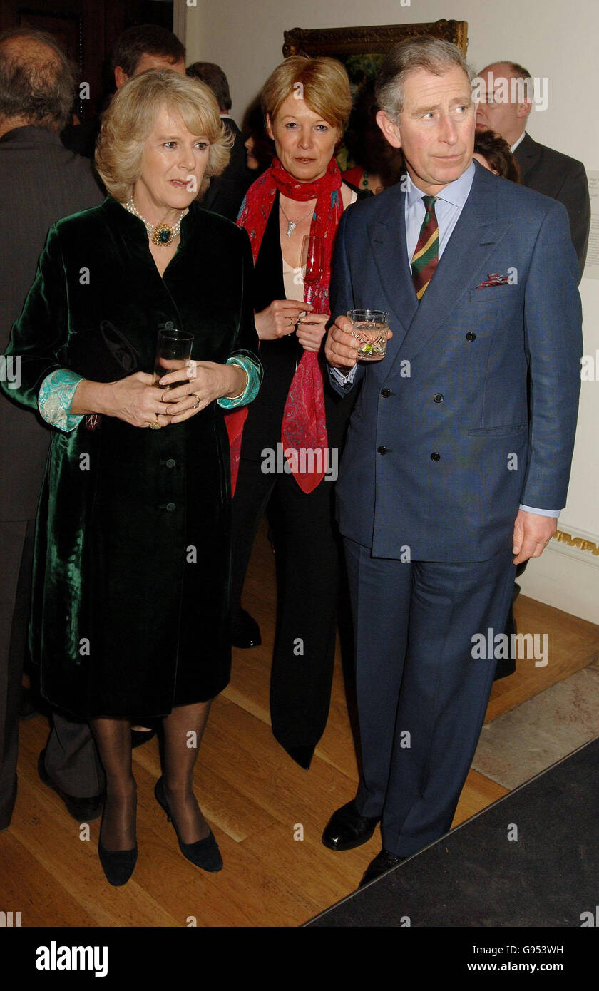 The Prince of Wales and the Duchess of Cornwall during the 100th Anniversary reception for the everyman Library, at the Royal Academy in Piccadilly Central London, Wednesday 15 February 2006. The couple were joined by authors, leading literary critics and publishers at a reception in the opulent John Madejski Fine Rooms at the Royal Academy of Arts, in central London. Camilla was dressed in an emerald green velvet dress and matching choker. PRESS ASSOCIATION Photo. Photo credit should read: John Stillwell/WPA/PA Stock Photo