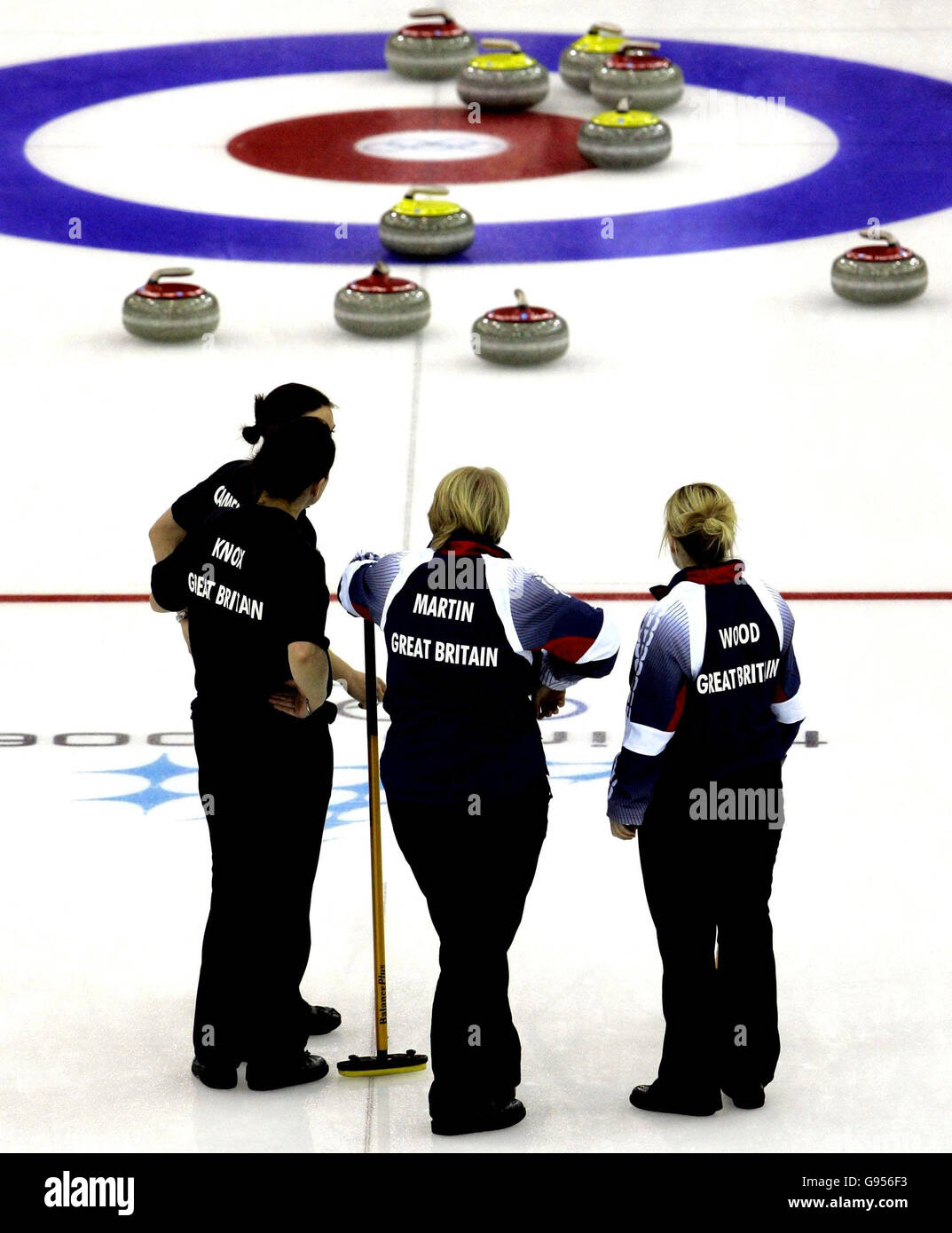 Great Britain team look on during the women's curling match against Japan at the Winter Olympics in Pinerolo Palaghiaccio, Italy. Stock Photo
