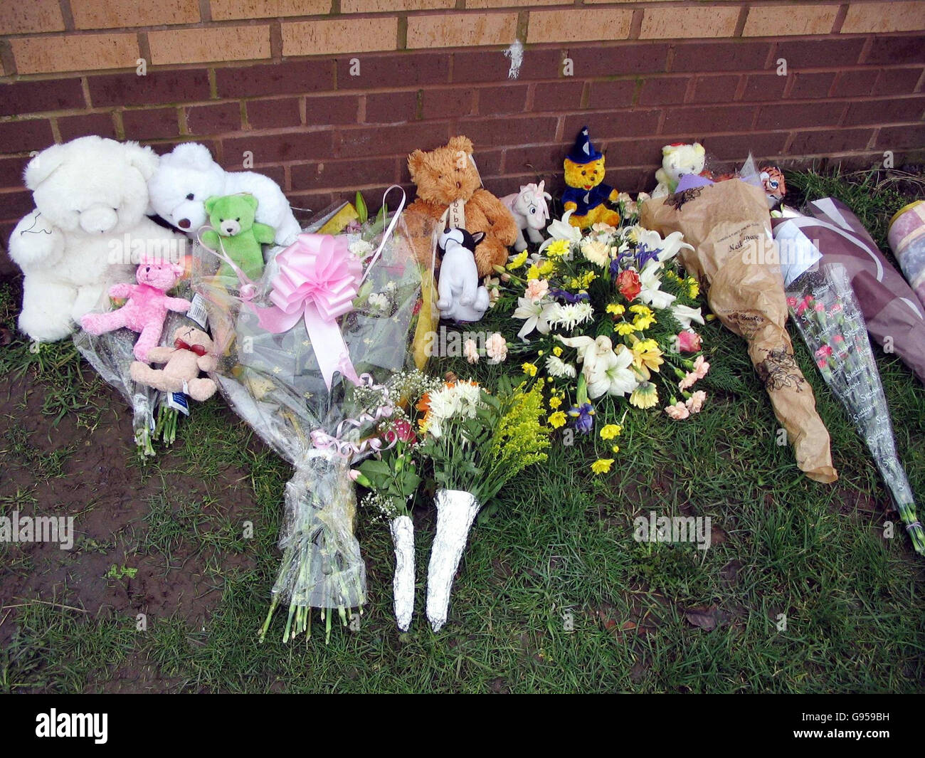 Floral tributes at the scene of a fatal house fire in Swale Drive in
