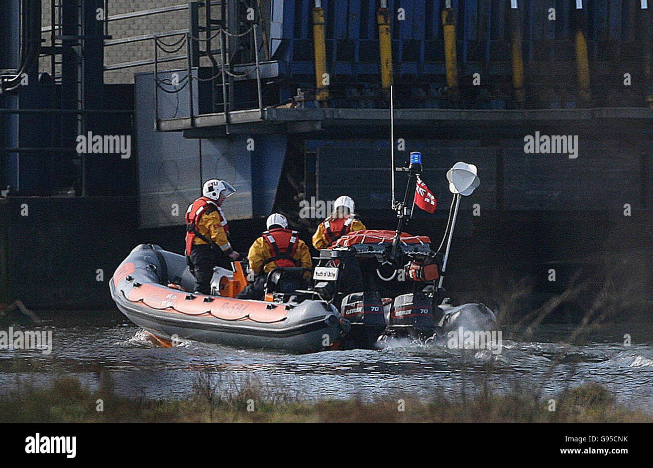 Coast guards conduct a search along the river Lagan near the Odyssey arena in Belfast after a 999 call reported a man in the river, Saturday March 4, 2006. See PA story ULSTER Search. PRESS ASSOCIATION Photo. Photo credit should read: Niall Carson/PA. Stock Photo
