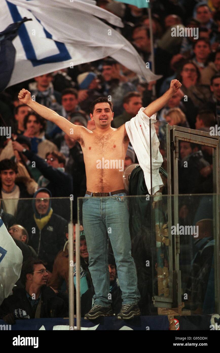 Italian Soccer - Serie A - Lazio v Roma. A Lazio fan braves the elements Stock Photo