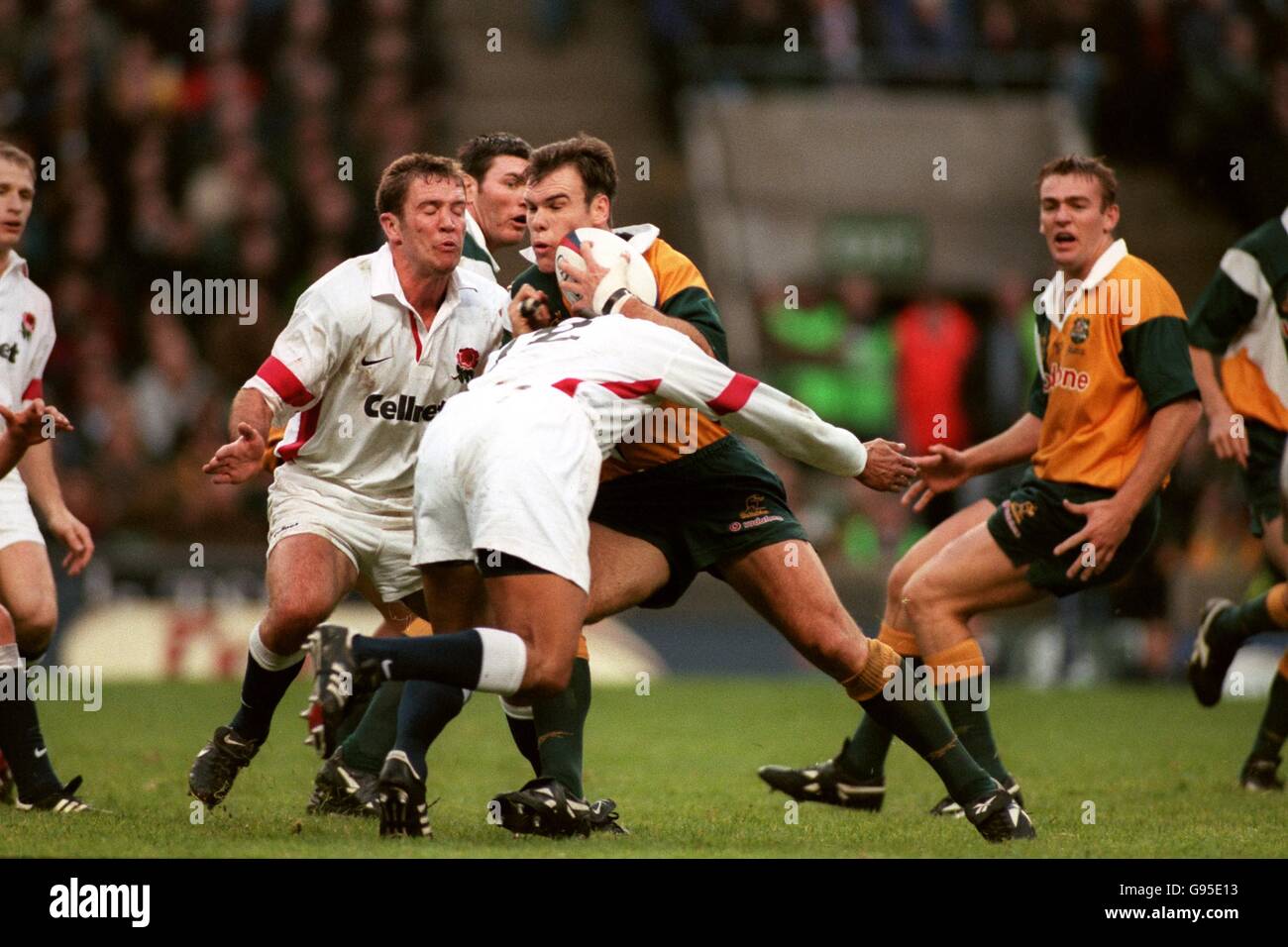 Nathan Grey Rugby Australia's Nathan Grey (second right) runs into the tackle of England ...