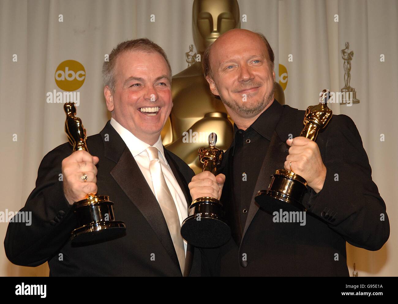 Paul Haggis (r) and Bobby Moresco with their awards for Best Original Screenplay for Crash Stock Photo