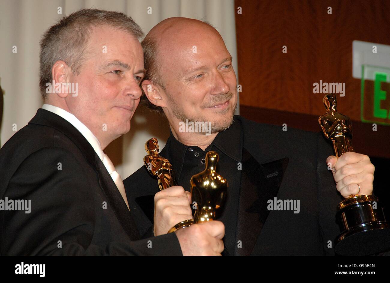 Paul Haggis (r) and Bobby Moresco with their awards for Best Original Screenplay for Crash Stock Photo