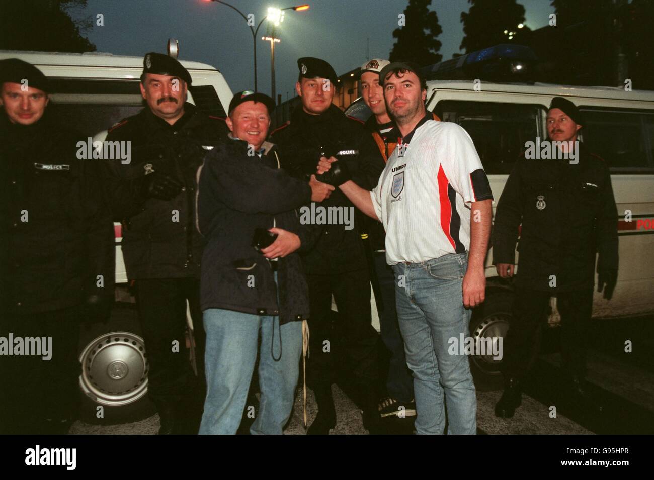 England fans pose with the luxembourg police hires stock photography