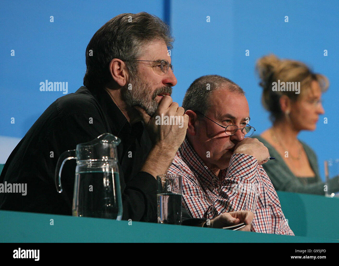 Sinn Fein Leader Gerry Adams and Chairman Mitchel McLaughlin listen to speeches at the Sinn Fein Party conference in Dublin, Friday February 17, 2006. See PA story ULSTER McGuinness. PRESS ASSOCIATION Photo. Photo credit should read: Niall Carson/PA Stock Photo