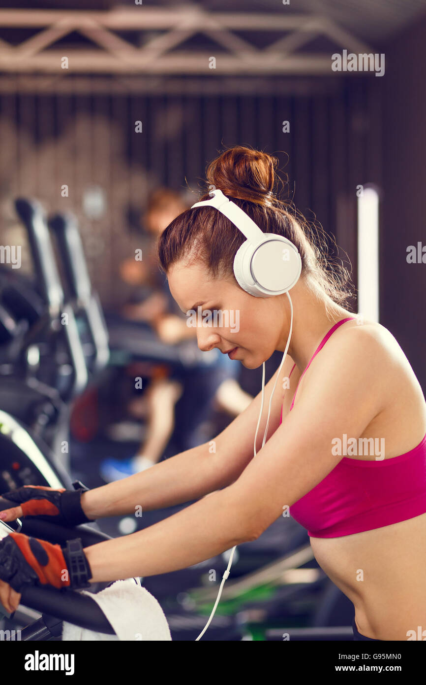 Fit woman on treadmill headphones hi-res stock photography and images -  Alamy
