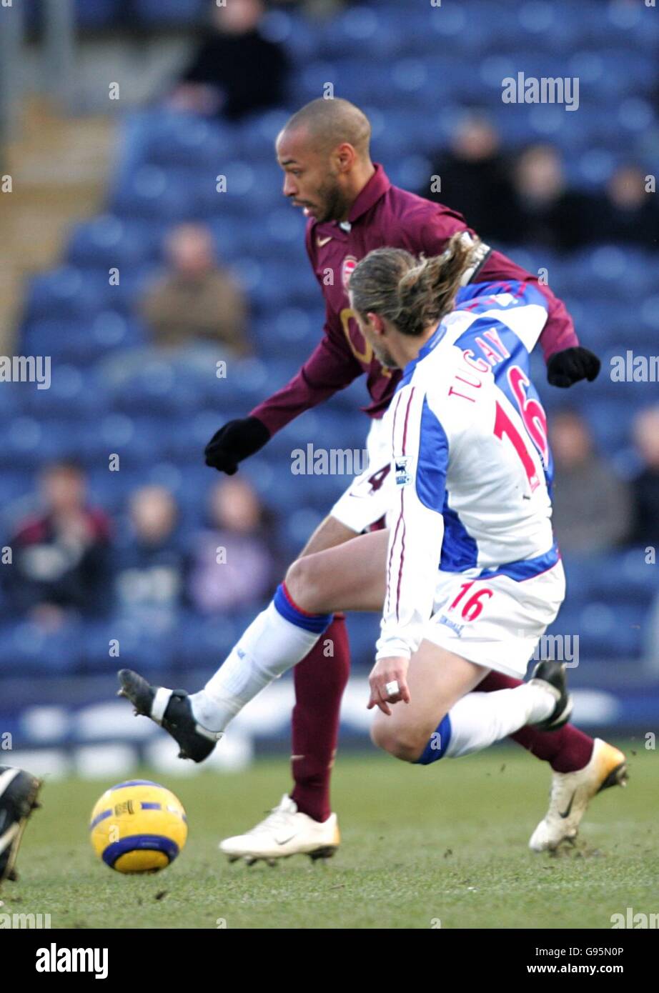 Blackburn Rovers' Kerimoglu Tugay challenges Arsenal's Thierry Henry ...