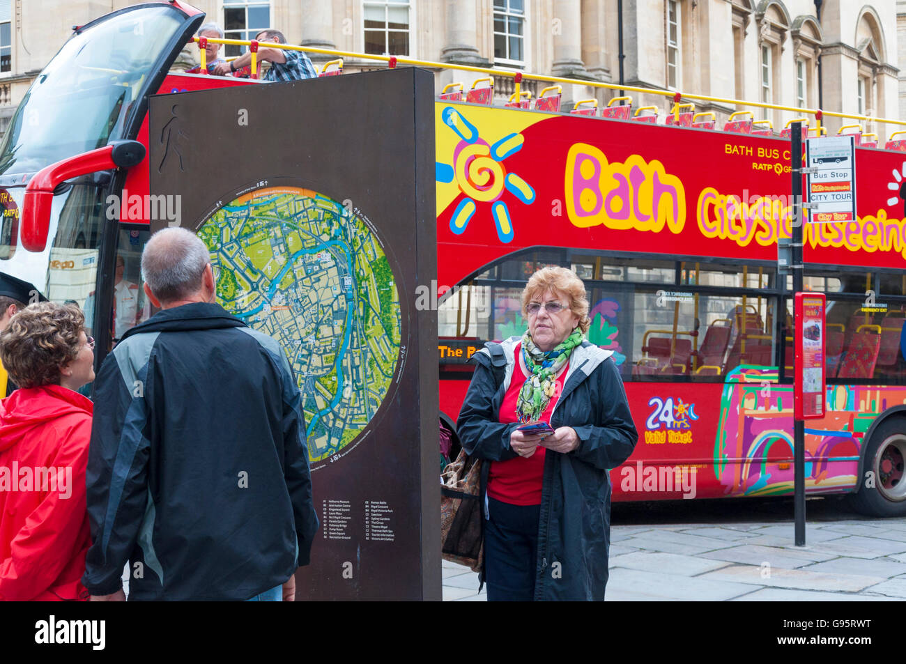 Tourists in Bath, Somerset, England, UK, look at a map of the spa city Stock Photo