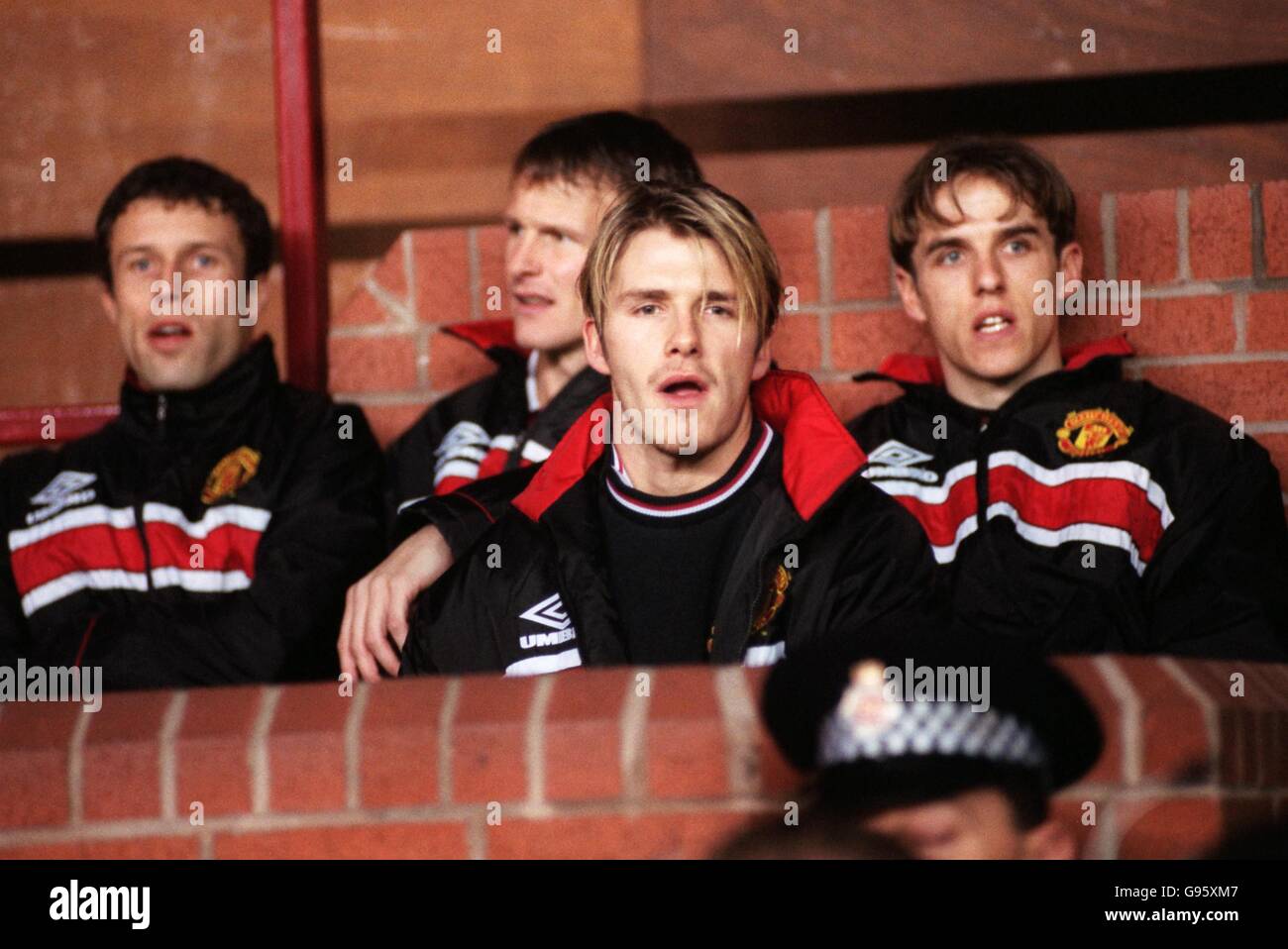 Manchester United's David Beckham (front), on the bench with teammates ...