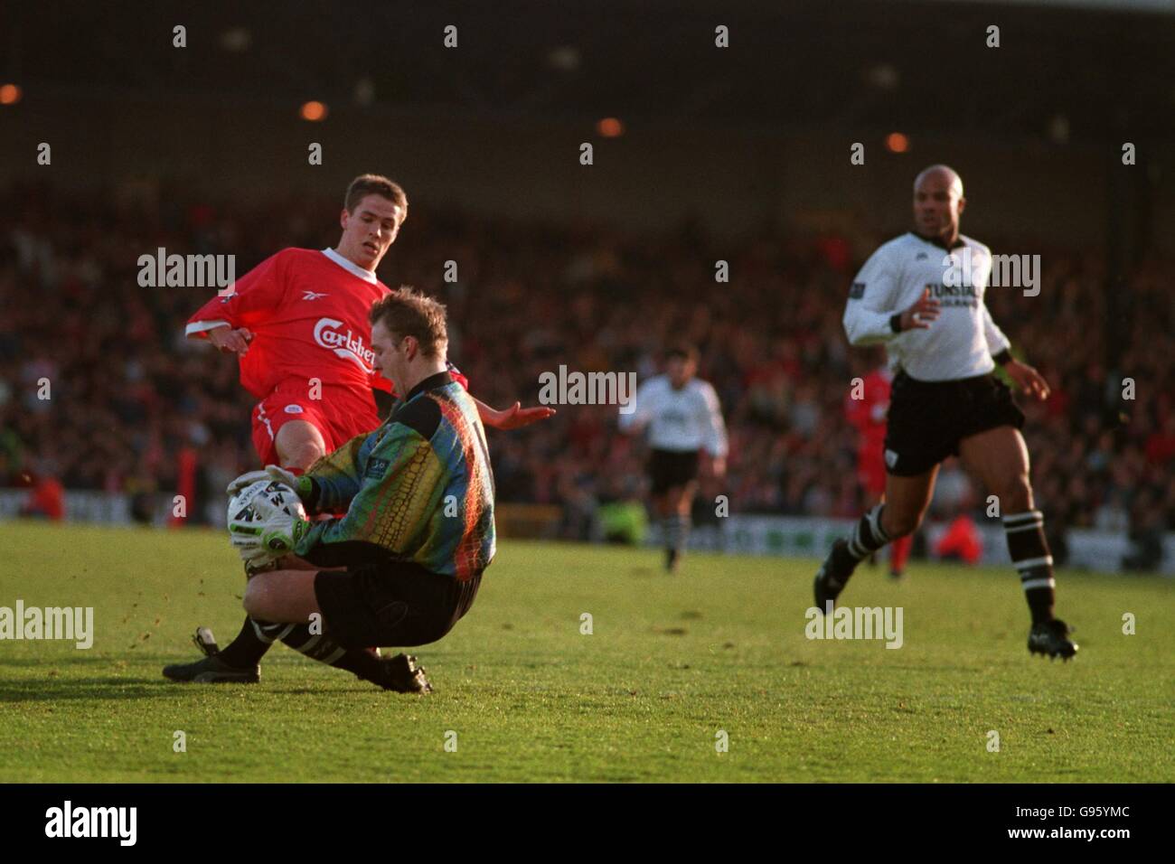 Port Vale goalkeeper Kevin Pilkington saves at the feet of Liverpool's Michael Owen Stock Photo