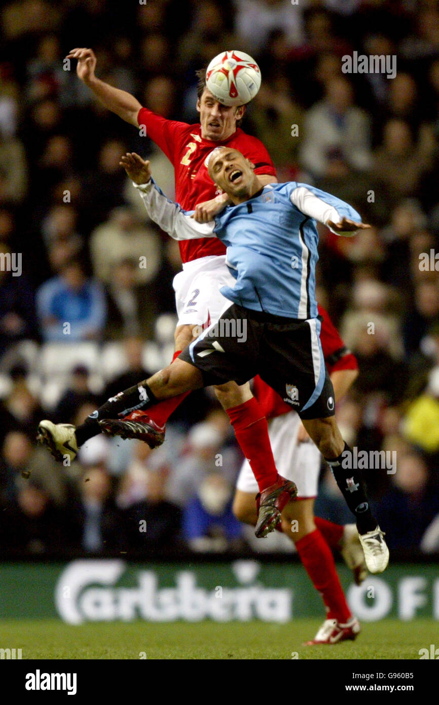 Soccer - International Friendly - England v Uruguay - Anfield. England's Gary Neville and Uruguay's Gustavo Varela Stock Photo