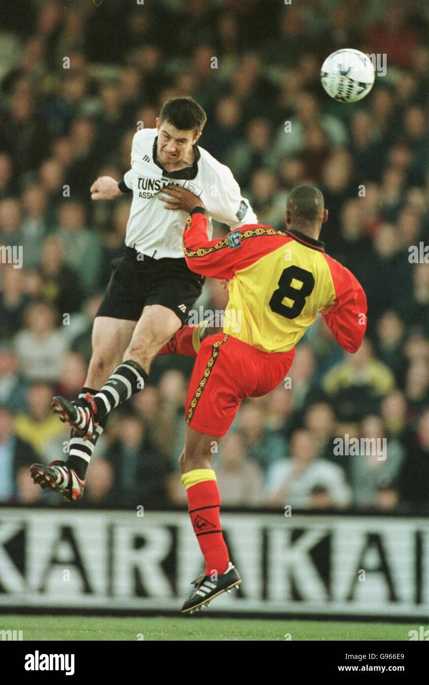 l-r Port Vale's Allen Lee outjumps Watford's Micah Hyde Stock Photo