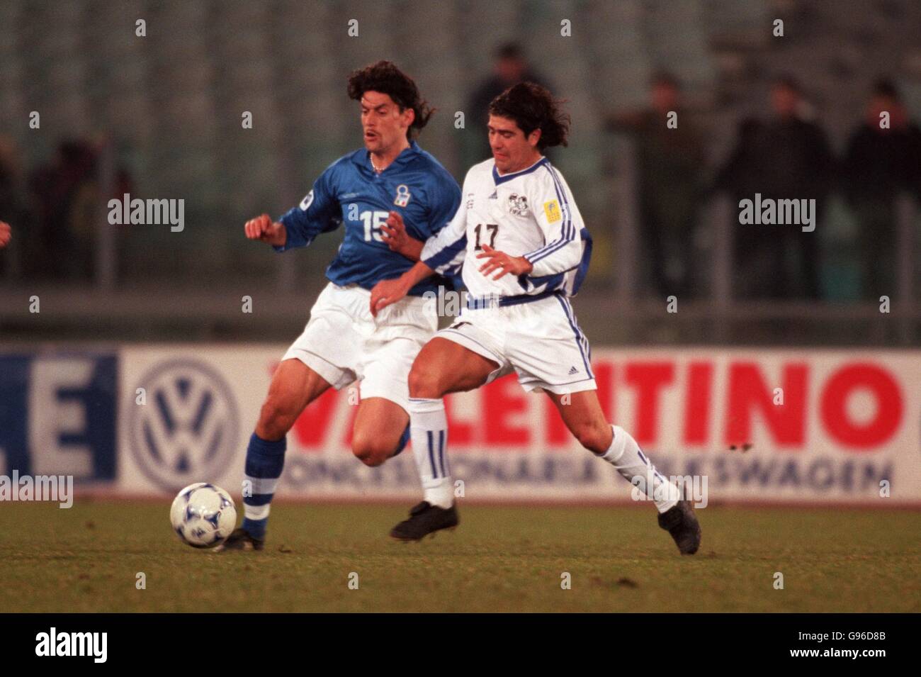 Soccer - Italian Federation Centenary Match - Italy v FIFA World Stars. Italy's Moreno Torrichelli (left) and Marcelo Salas of the FIFA World Stars (right) in a race for the ball Stock Photo