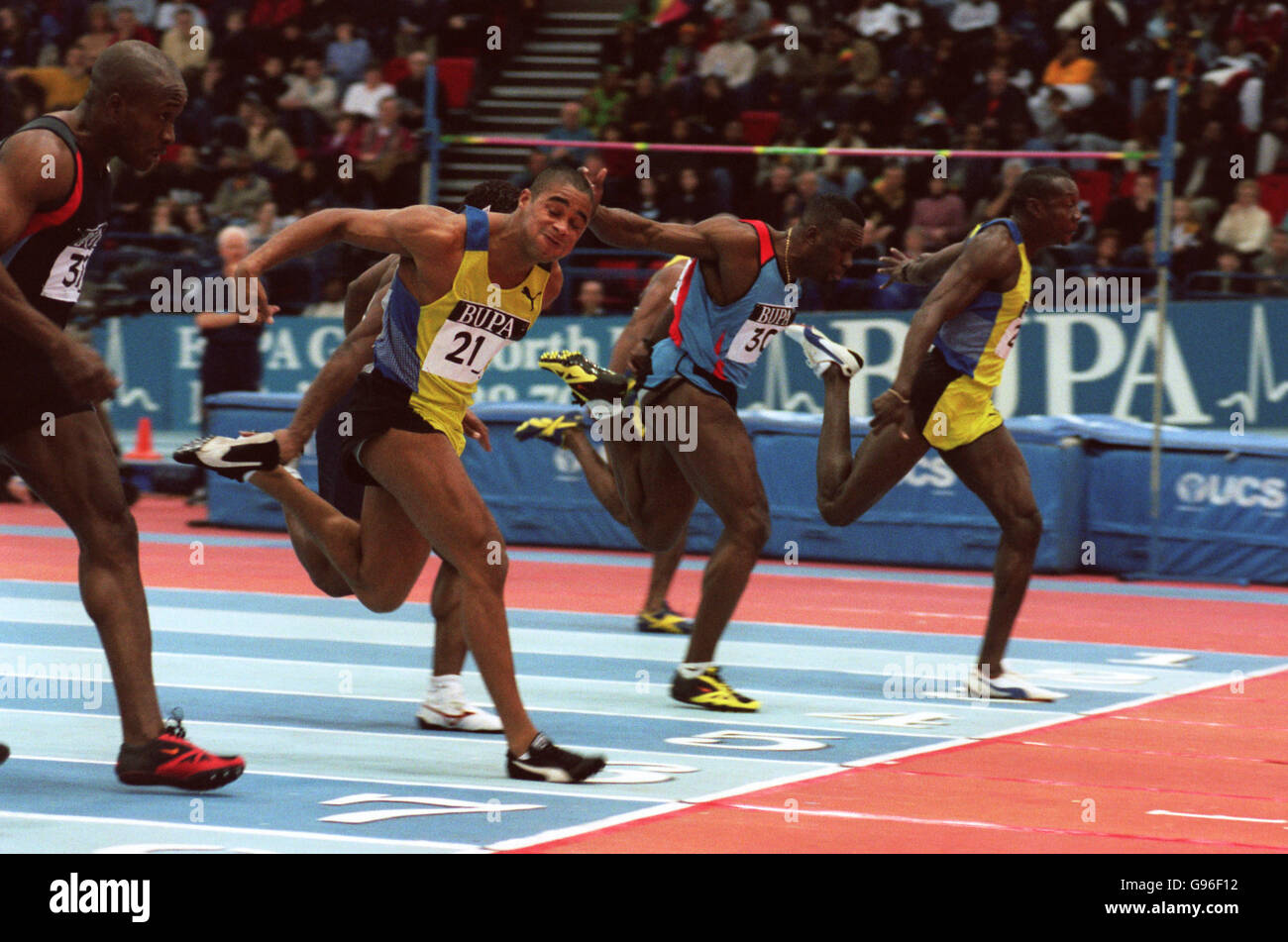 Deji Aliu of Nigeria (right) comes home to win the first heat of the men's 60m from Great Britain's Jason Gardener (second left) Stock Photo