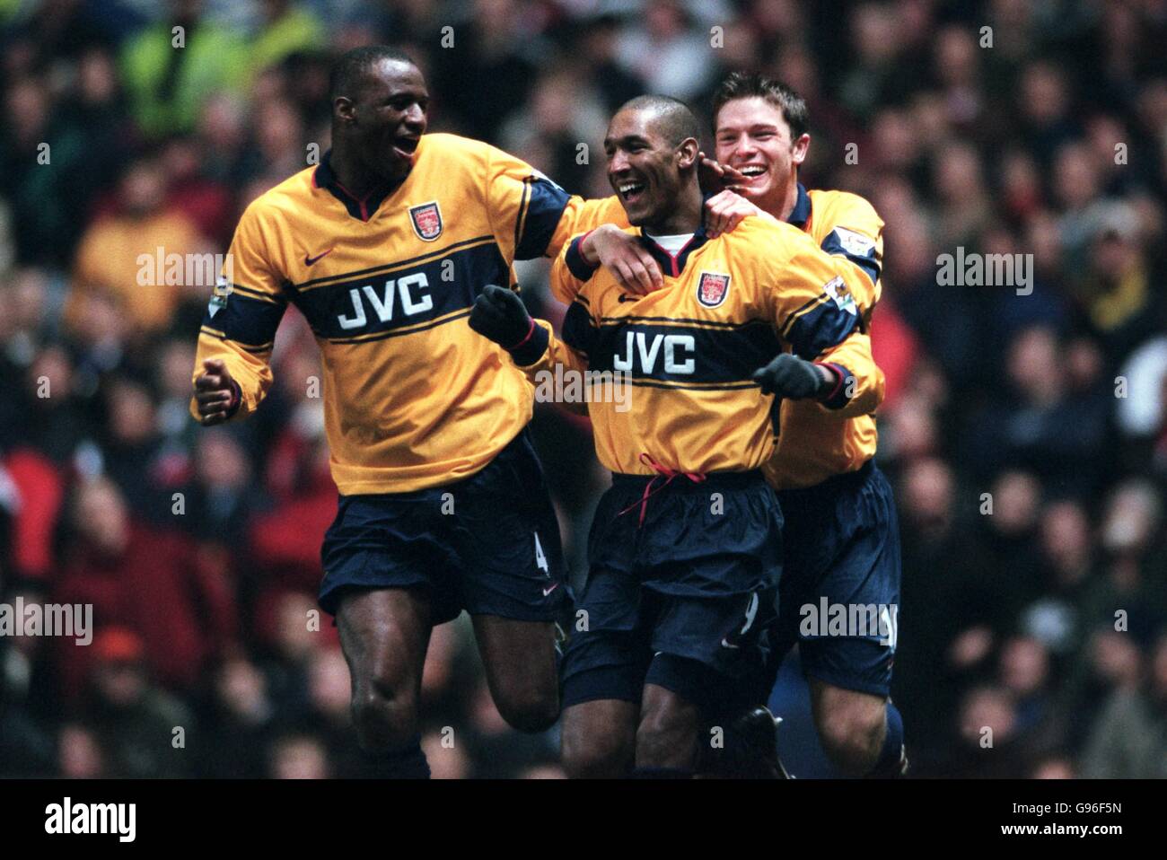 l-r; Patrick Vieira and Stephen Hughes congratulate Nicolas Anelka on scoring for Arsenal Stock Photo
