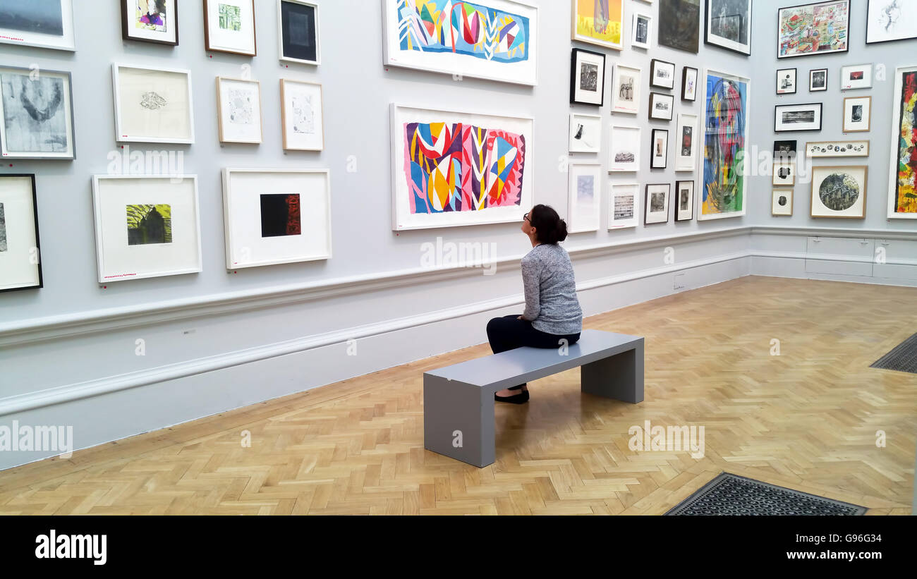 Art lover viewing art works in Royal Academy Stock Photo