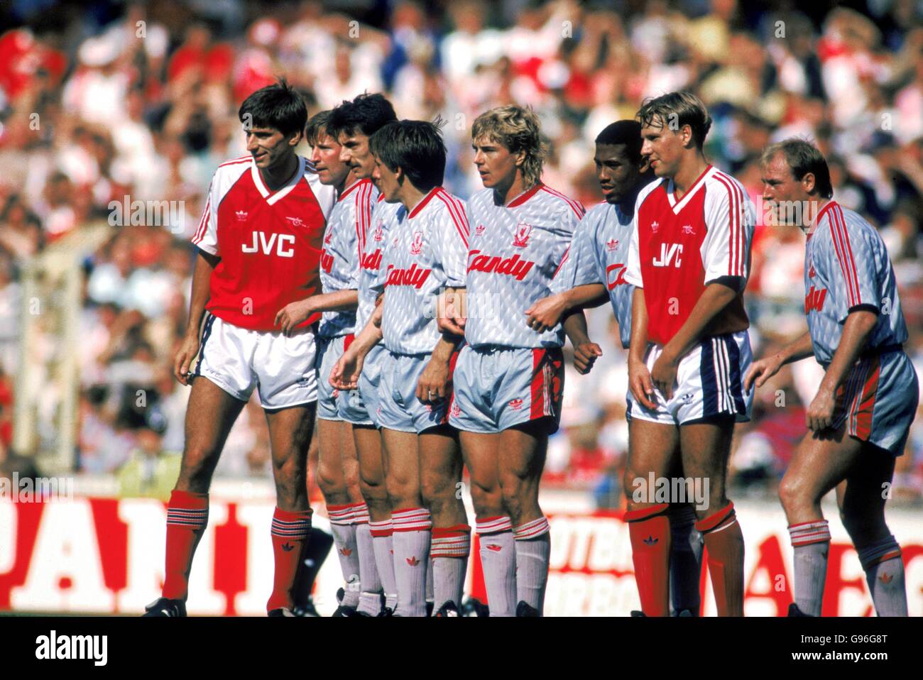 Arsenal's Alan Smith (left) and Paul Merson (second right) infiltrate the Liverpool defensive wall (l-r): Ronnie Whelan, Ian Rush, Peter Beardsley, Barry Venison, John Barnes, Steve McMahon Stock Photo