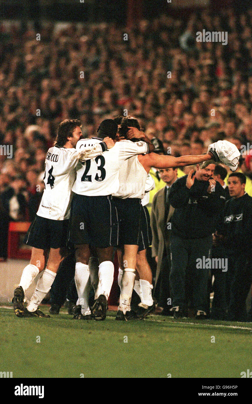 Tottenham Hotspur's David Ginola shows his shirt to Spurs fan after he  scored Stock Photo - Alamy