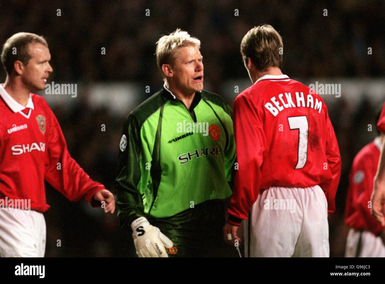 Manchester United goalkeeper Peter Schmeichel (centre) appears to be shouting at David Beckham (right) as teammate Henning Berg (left) looks on Stock Photo