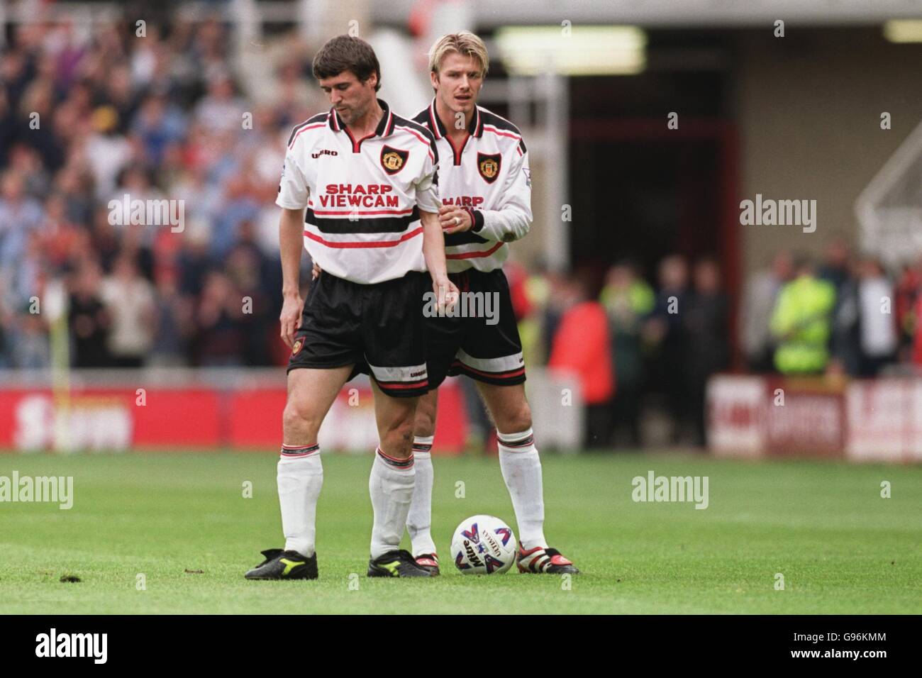 Soccer - FA Carling Premiership - Middlesbrough v Manchester United. Manchester United's David Beckham comforts Roy Keane after getting injured Stock Photo