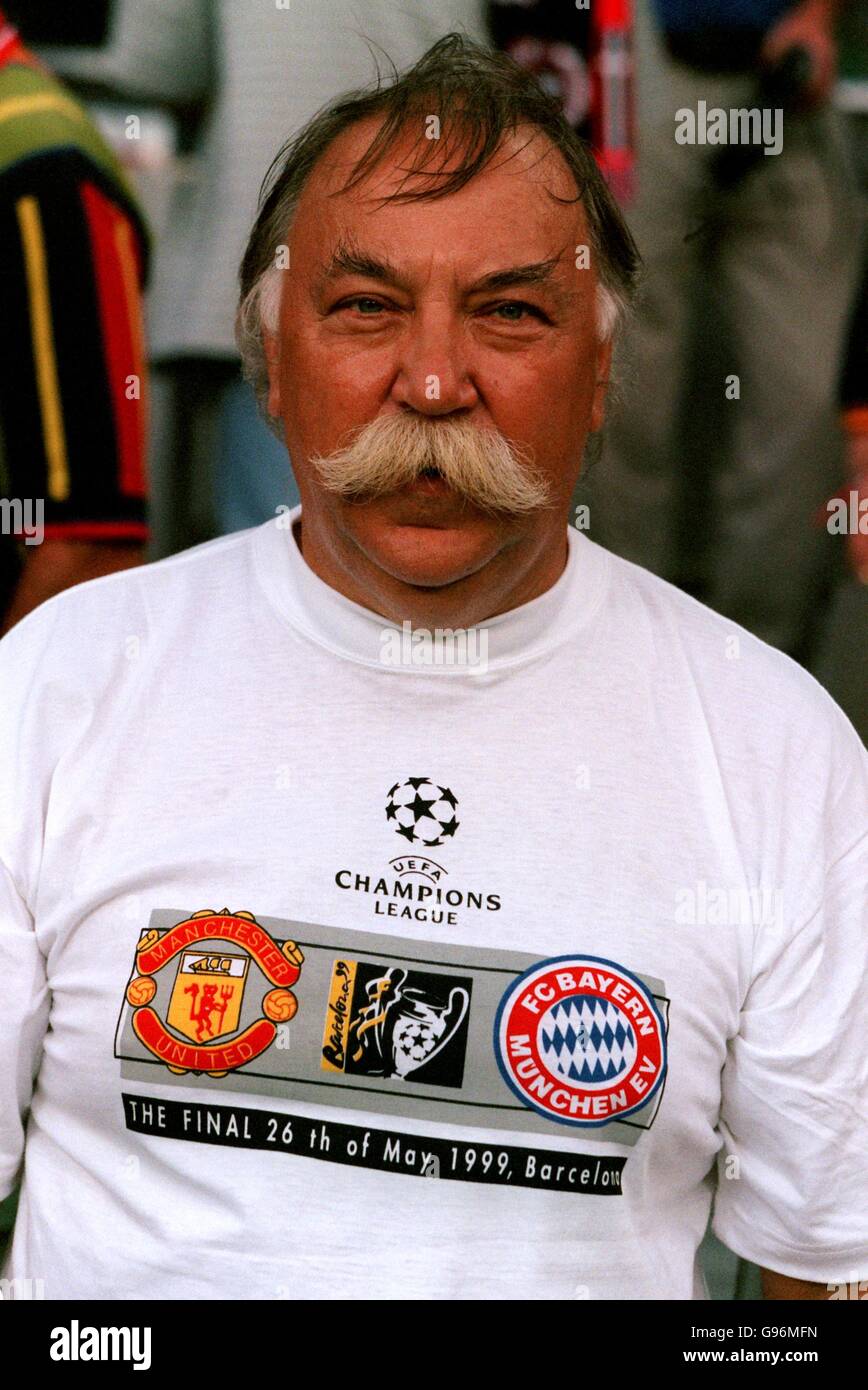 A fan wearing a champions league final tee shirt hires stock