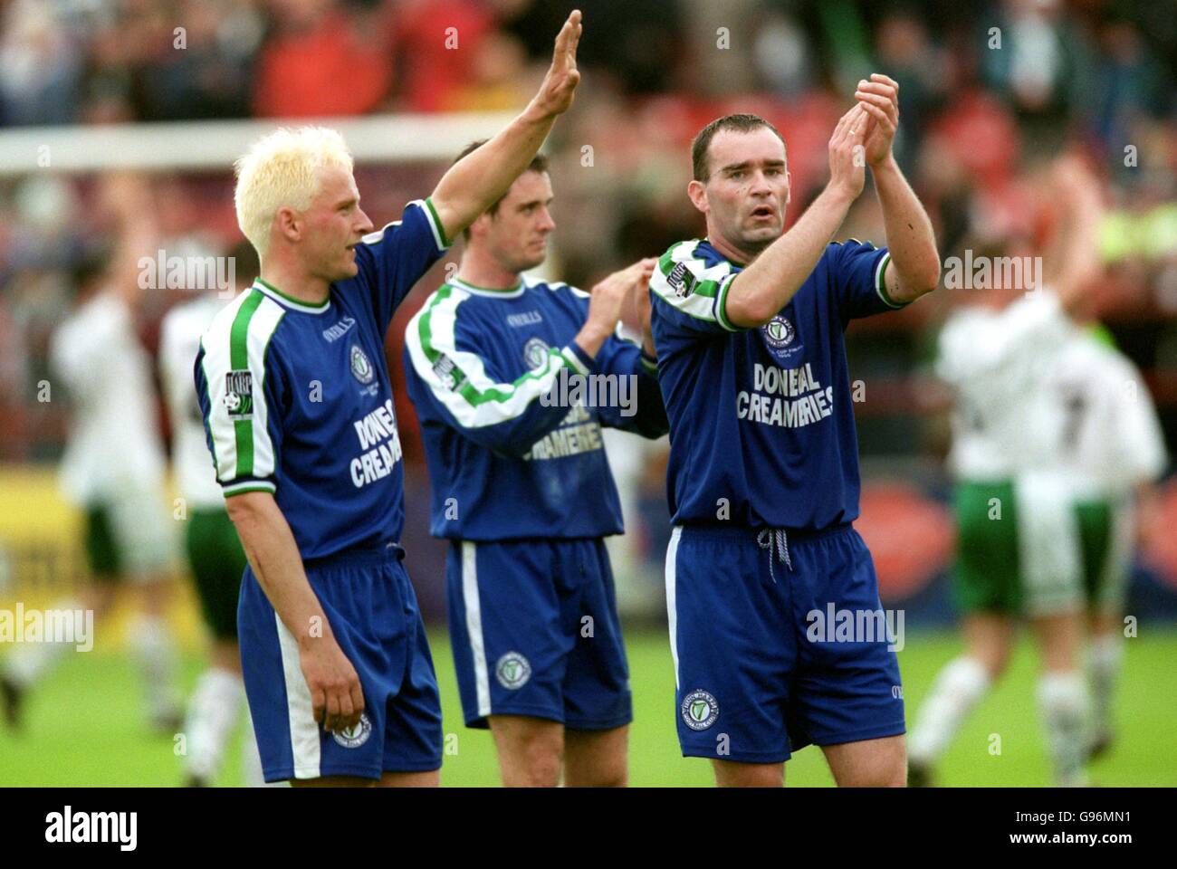 Finn Harps' Gavin Dykes (left) and Trevor Scanlon (right) applaud the fans after the match, which ended goalless Stock Photo