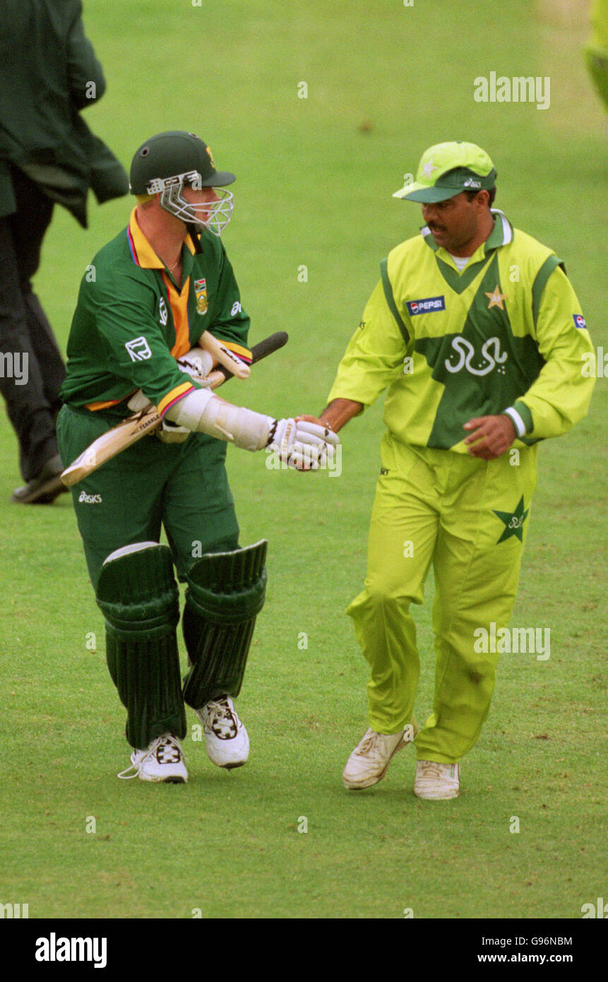 Cricket - ICC World Cup - Super Six - South Africa v Pakistan. South Africa's Lance Klusener is congratulated by Pakistan's Ijaz Ahmed after he steared South Africa to victory in the final over. Stock Photo