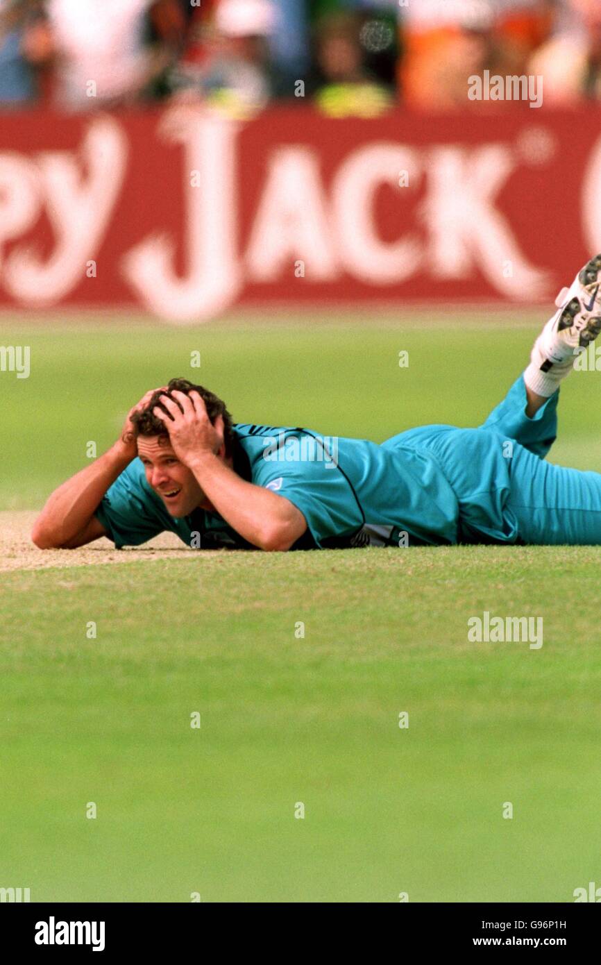 Cricket - ICC World Cup - Super Six - India v New Zealand. New Zealand's Chris Cairns looks on as he lies on the floor Stock Photo