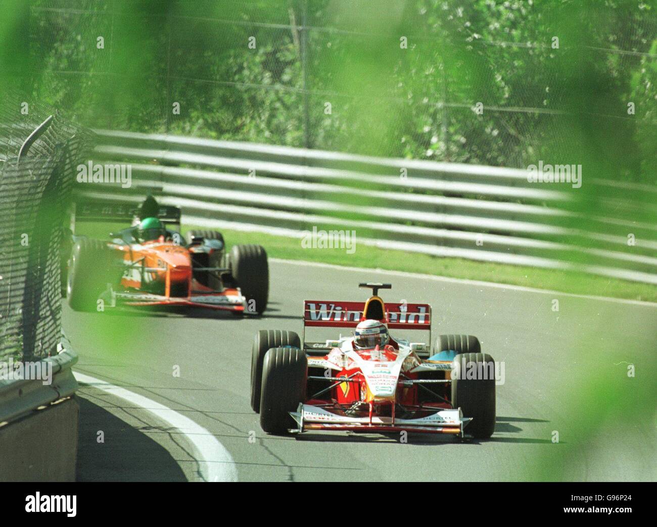 Formula One Motor Racing - Canadian Grand Prix - Qualifying. Alex Zanardi leads Takagi round the Montreal circuit Stock Photo