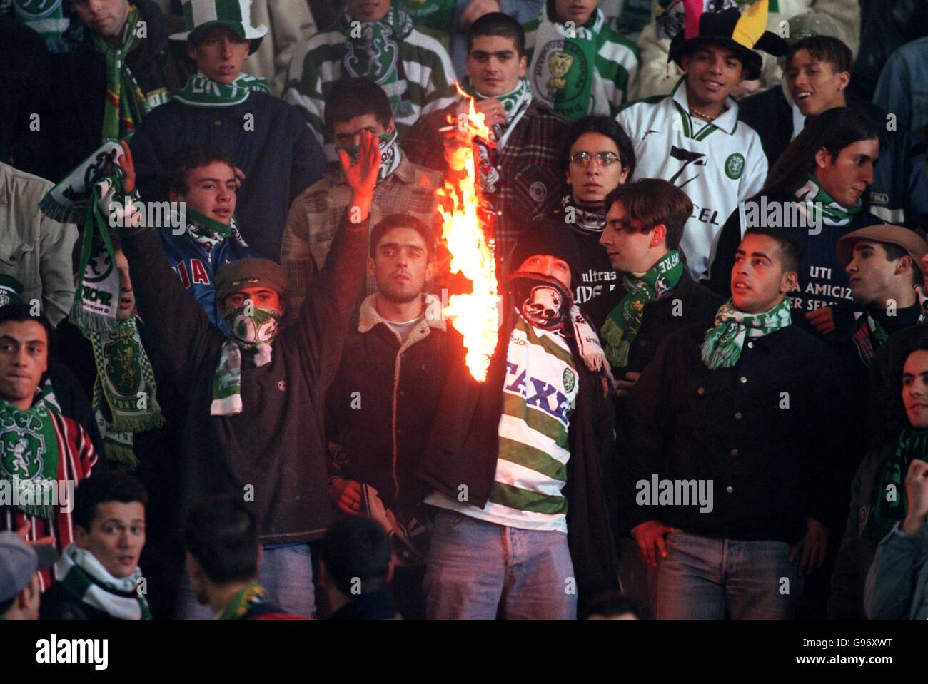 Sporting lisbon fans burn a benfica scarf hires stock photography and