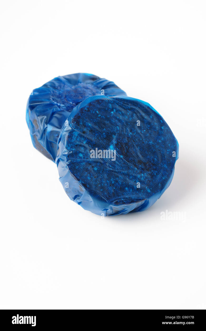 Blue soluble toilet cistern blocks used for cleaning lavatories Stock Photo