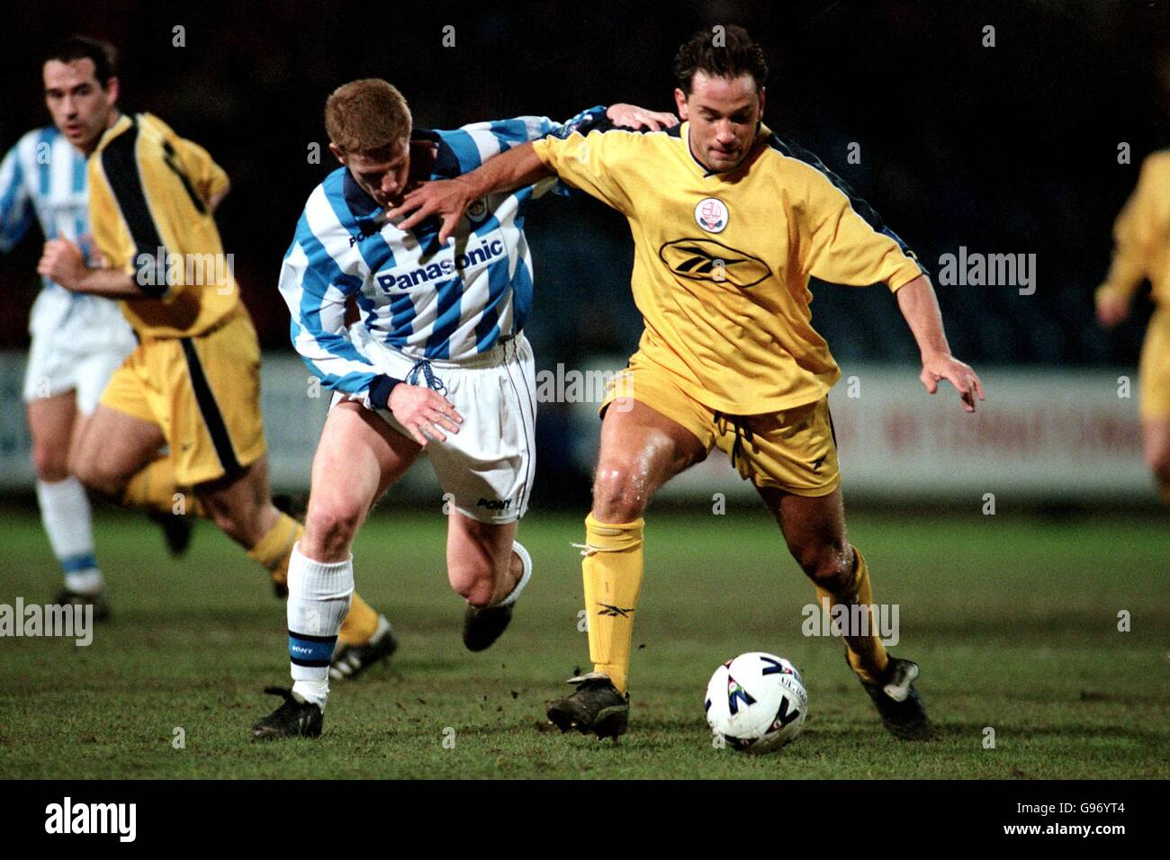 Huddersfield Town's Craig Armstrong is held off by Bolton Wanderers' goalscorer Dean Holdsworth Stock Photo